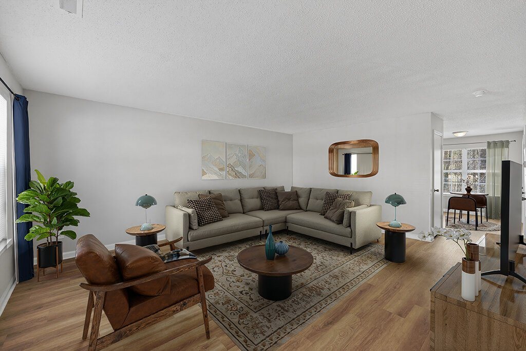Living room with hardwood floors at Greens of Pine Glen in Durham NC